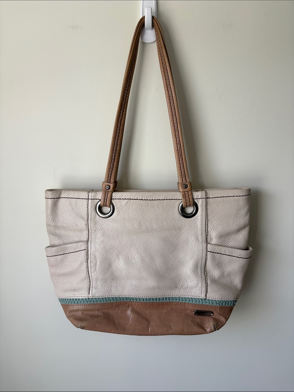 The Sak Two-Tone Leather Tote in Cream and Brown with Teal Accent